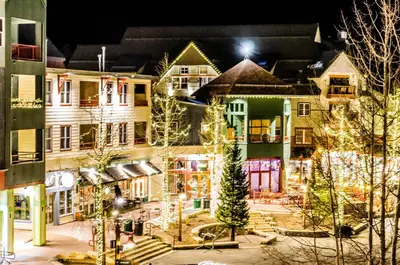 a group of buildings with christmas lights on them at Alcove 39 in Keystone