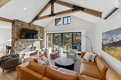 a living room with a couch and a fireplace at Alcove 39 in Keystone