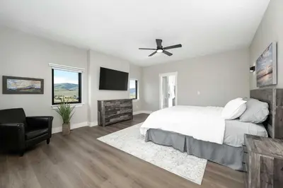 a bedroom with a bed and a ceiling fan at Saddle Ridge, 0021 in Granby