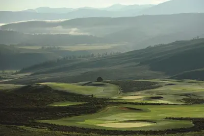 a view of a golf course in the mountains at Saddle Ridge, 0021 in Granby