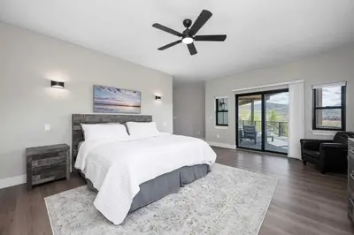 a bedroom with a bed and a ceiling fan at Saddle Ridge, 0021 in Granby