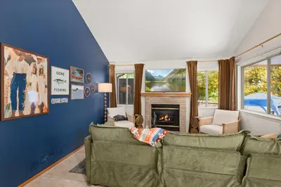 a living room with two couches and a fireplace at Game Room Paradise, Firepit & Outdoor Movies in Arvada