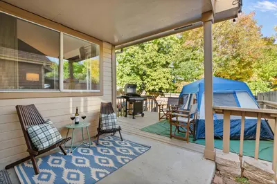 a gazebo on the back porch of a house at Game Room Paradise, Firepit & Outdoor Movies in Arvada