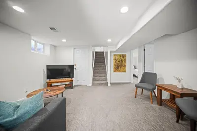 a living room with a couch and a tv at Family Home - Dog-Friendly - Fire Pit in Arvada