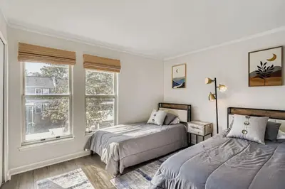a bedroom with two beds and a window at The Santa Fe Spot Walk to Eats, Drinks and Fun in Denver