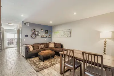 a living room with a couch and a table at The Santa Fe Spot Walk to Eats, Drinks and Fun in Denver