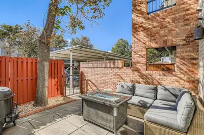 a brick house with a couch and a table at The Santa Fe Spot Walk to Eats, Drinks and Fun in Denver