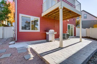 a red house with a grill in front of it at Near Denver airport 20 min away from downtown in DEN