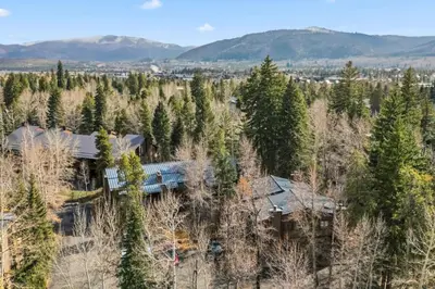 an aerial view of a house in the trees at Mountain Charmer Steps to Main St and Trails in Frisco