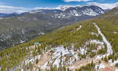 an aerial view of a mountain with houses and trees at Cozy Mountain Cabin with Stunning Views in Idaho Springs