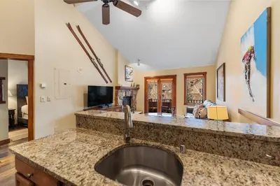 a kitchen with a sink with a counter top at Arapahoe Lodge 8137 in Keystone