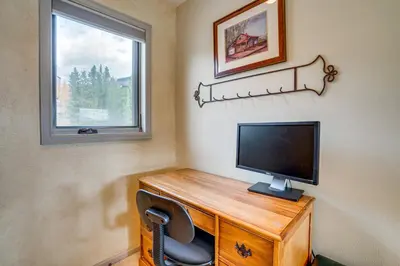 a room with a desk with a television and a window at 3 Mi to Dtwn Pet-Friendly Condo in Silverthone in Silverthorne