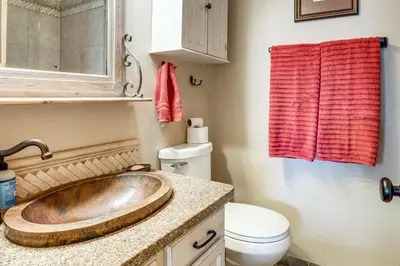 a bathroom with a copper sink and a toilet at 3 Mi to Dtwn Pet-Friendly Condo in Silverthone in Silverthorne
