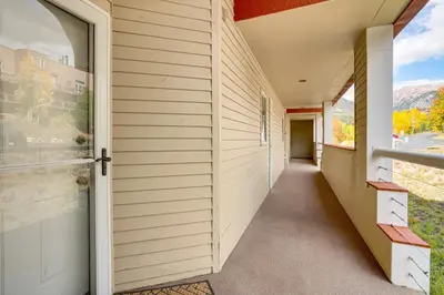 an empty hallway of a house with a window at 3 Mi to Dtwn Pet-Friendly Condo in Silverthone in Silverthorne