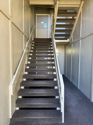 a stairway in a building with a stair case at Summit County Wildernest Condo in Silverthorne