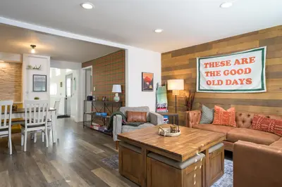 a living room with a couch and a table at Cozy Family Retreat with Yard - Walk to Olde Town in Arvada