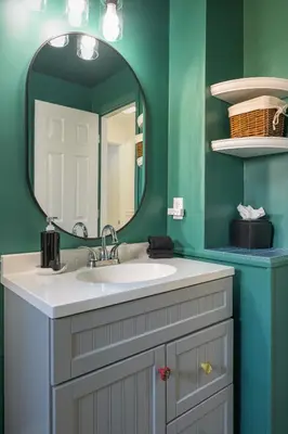 a bathroom with a sink and a mirror at Cozy Family Retreat with Yard - Walk to Olde Town in Arvada