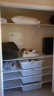 a closet filled with white drawers and pillows at Meadow Ridge Mountain Views 8 minutes from Basecamp in Winter Park