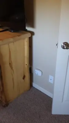 a room with a wooden table with a television on it at Meadow Ridge Mountain Views 8 minutes from Basecamp in Winter Park