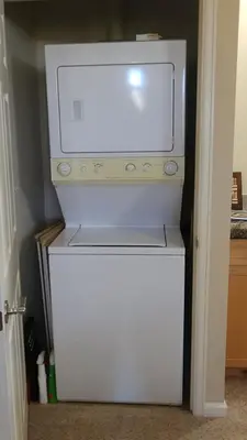 a white refrigerator with a microwave on top of it at Meadow Ridge Mountain Views 8 minutes from Basecamp in Winter Park