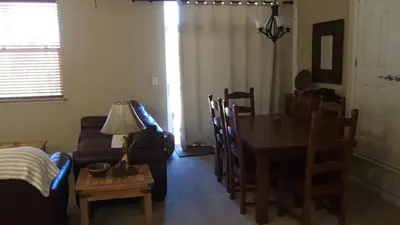 a living room with a table and a couch at Meadow Ridge Mountain Views 8 minutes from Basecamp in Winter Park