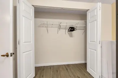 a room with an open door with a closet at 6BD Near DT - BBQ Grill, Games & Football Fun in Arvada