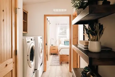 a laundry room with a washer and dryer at Ralston Creek Cottage - Serene Park Views in Arvada