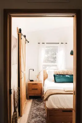 a bedroom with a bed and a window at Ralston Creek Cottage - Serene Park Views in Arvada
