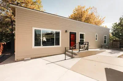 a building with a staircase in front of it at Ralston Creek Cottage - Serene Park Views in Arvada