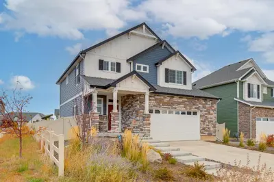 a house with a green and white at Newly Built Home with Garage, 10 Mi to Anschutz! in Aurora
