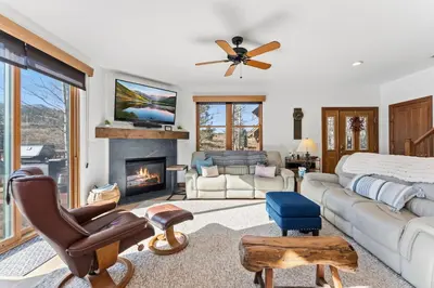 a living room with a couch and a fireplace at Breckenridge Stay Hot Tub Walk to Trails in Breckenridge