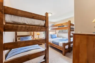 a bedroom with two bunk beds in a room at Breckenridge Stay Hot Tub Walk to Trails in Breckenridge