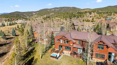 an aerial view of a home with a mountain in the background at Breckenridge Stay Hot Tub Walk to Trails in Breckenridge