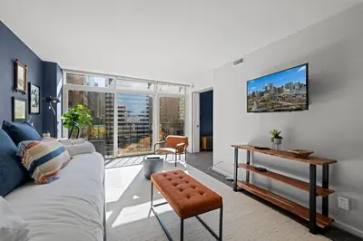 a living room with a couch and a table at 1777 Larimer 910 in Denver