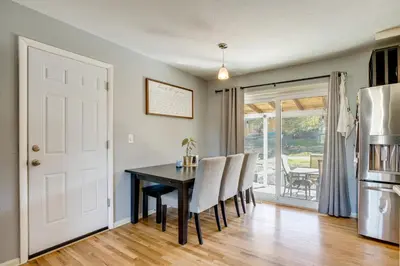 a kitchen and dining room with a table and chairs at Furnished Patio! Suburban Gem 11 Mi to Dtwn Denver in Arvada