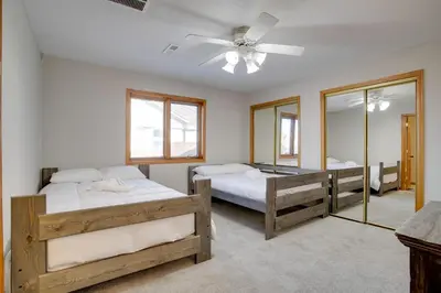 a bedroom with two beds and a ceiling fan at Private Pool and Yard Spacious Brighton Home! in Brighton