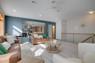 a living room with a couch and a table at Private Pool and Yard Spacious Brighton Home! in Brighton