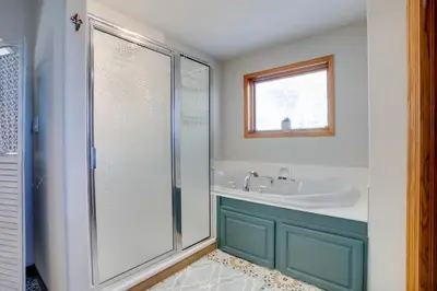 a bathroom with a shower and a sink at Private Pool and Yard Spacious Brighton Home! in Brighton