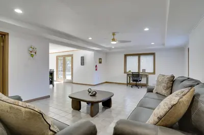 a living room with a couch and a coffee table at Private Pool and Yard Spacious Brighton Home! in Brighton