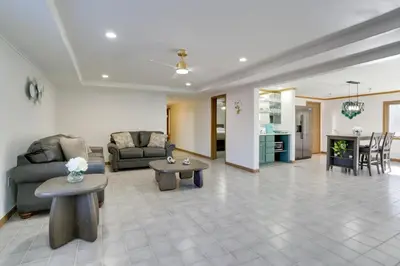 a living room with a couch and a table at 6 Mi to Barr Lake Apt with Yard and Pool Access! in Brighton