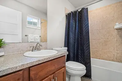 a bathroom with a sink and a toilet at The Revive Loft with Balcony, Workspace and Bikes in Fort Collins