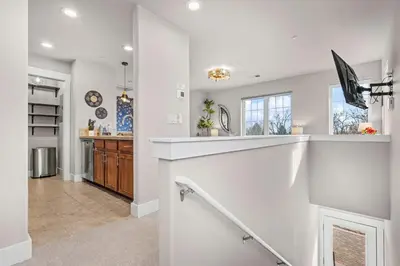 a kitchen with white walls and a counter top at The Revive Loft with Balcony, Workspace and Bikes in Fort Collins
