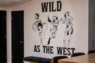 a wall mural of wild as the west at The Wild Western - 5Bed, Hot Tub, Sauna, Mini Putt, Fire Pit in Denver