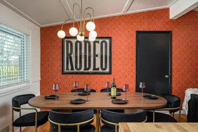 a dining room with a table and chairs at The Wild Western - 5Bed, Hot Tub, Sauna, Mini Putt, Fire Pit in Denver