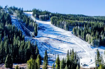 a ski slope with snow and trees on a mountain at Seasons at Keystone 1841 in Keystone