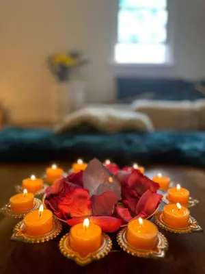 a group of candles and flowers on a table at Temple Of Divine Light in Boulder
