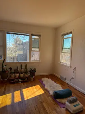 an empty living room with a lot of windows at Temple Of Divine Light in Boulder