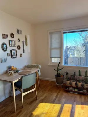 a dining room with a table and a window at Temple Of Divine Light in Boulder