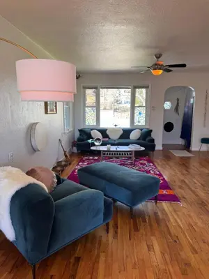 a living room with blue couches and a couch at Temple Of Divine Light in Boulder