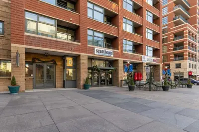 a large brick building with a courtyard in front of it at Union Station downtown and gameday retreat! in Denver